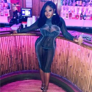 See through pin stripe dress.